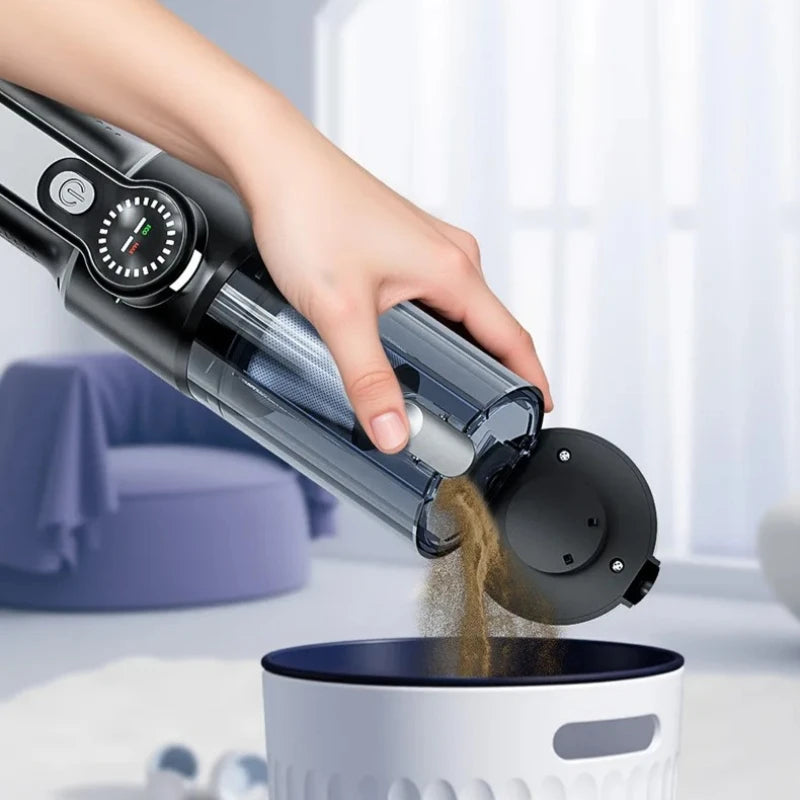 Portable handheld vacuum cleaner being used to clean car seat and interior
